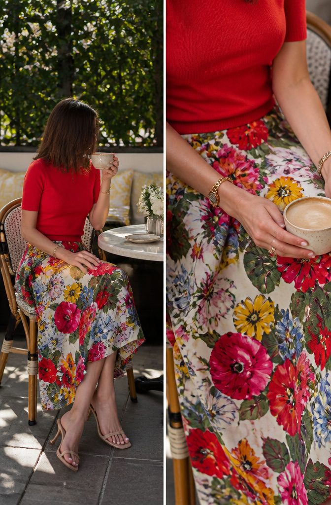 A red floral blouse paired with solid red accessories.