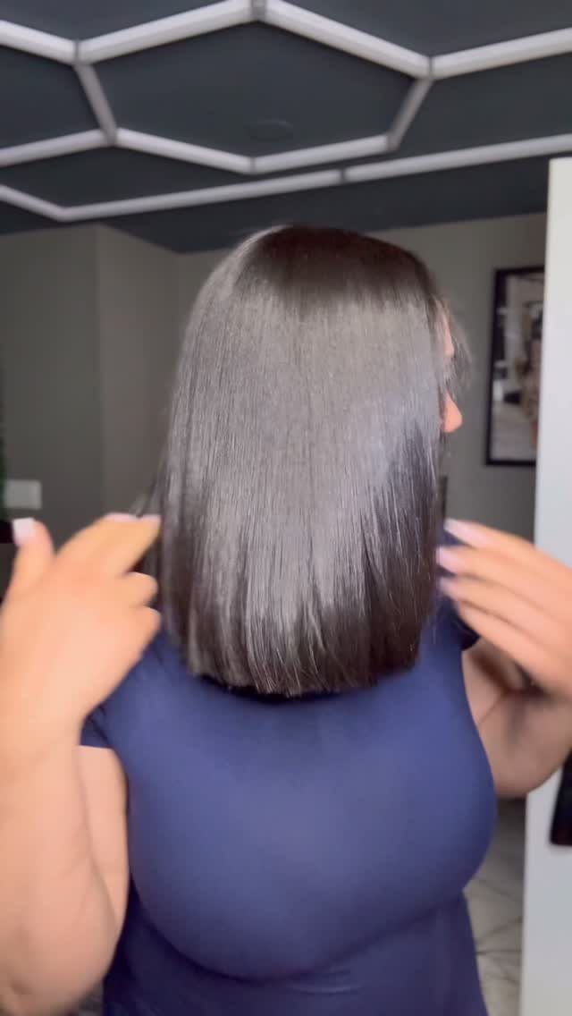 16 Shoulder Length Layered Hair Ideas for Every Texture 8 Straight dark brown hair in a blunt shoulder length cut on a person.